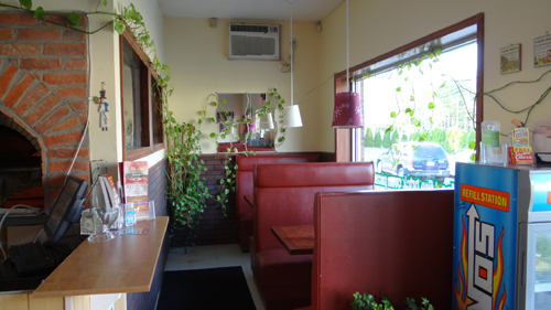 View of our cozy booths for dining in at Empire Pizza in Plainville, CT